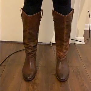 Tall brown Frye cowboy boot